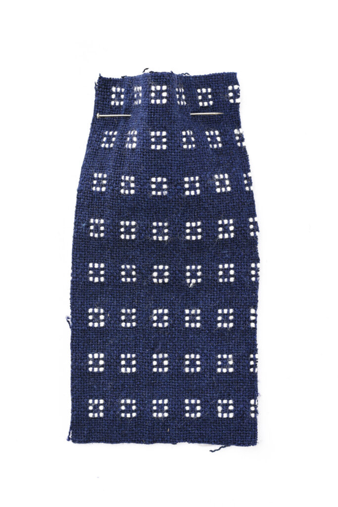KVADRAT double weave with white stitches that create a square
